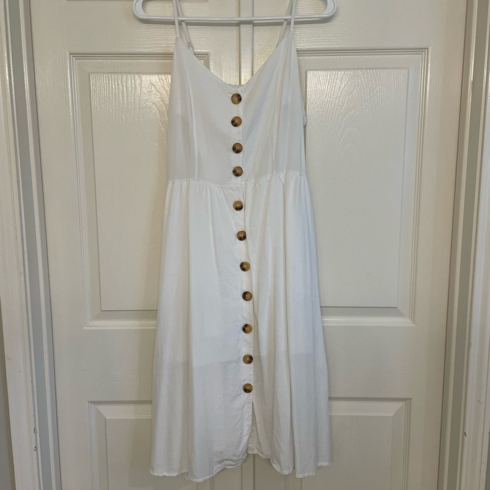 White dress with large buttons